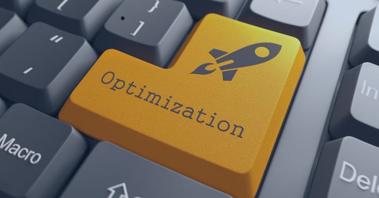 Job Posting Optimization: Close-up of a computer keyboard with a large, yellow key labeled 'Optimization' featuring a rocket icon, symbolizing efficiency and improvement.