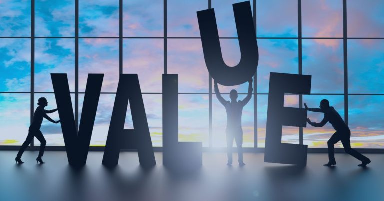 Staffing Agency Value Proposition: Silhouettes of three people assembling large letters to spell "VALUE" against a backdrop of a glass window with a colorful sunset.