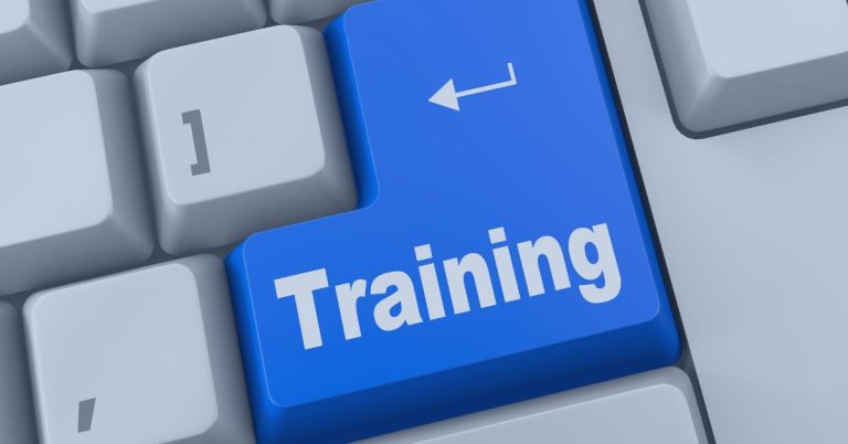 Training is a Priority: A close-up of a computer keyboard with a large blue key labeled 'Training,' replacing the traditional Enter key, symbolizing learning and professional development in a digital environment.